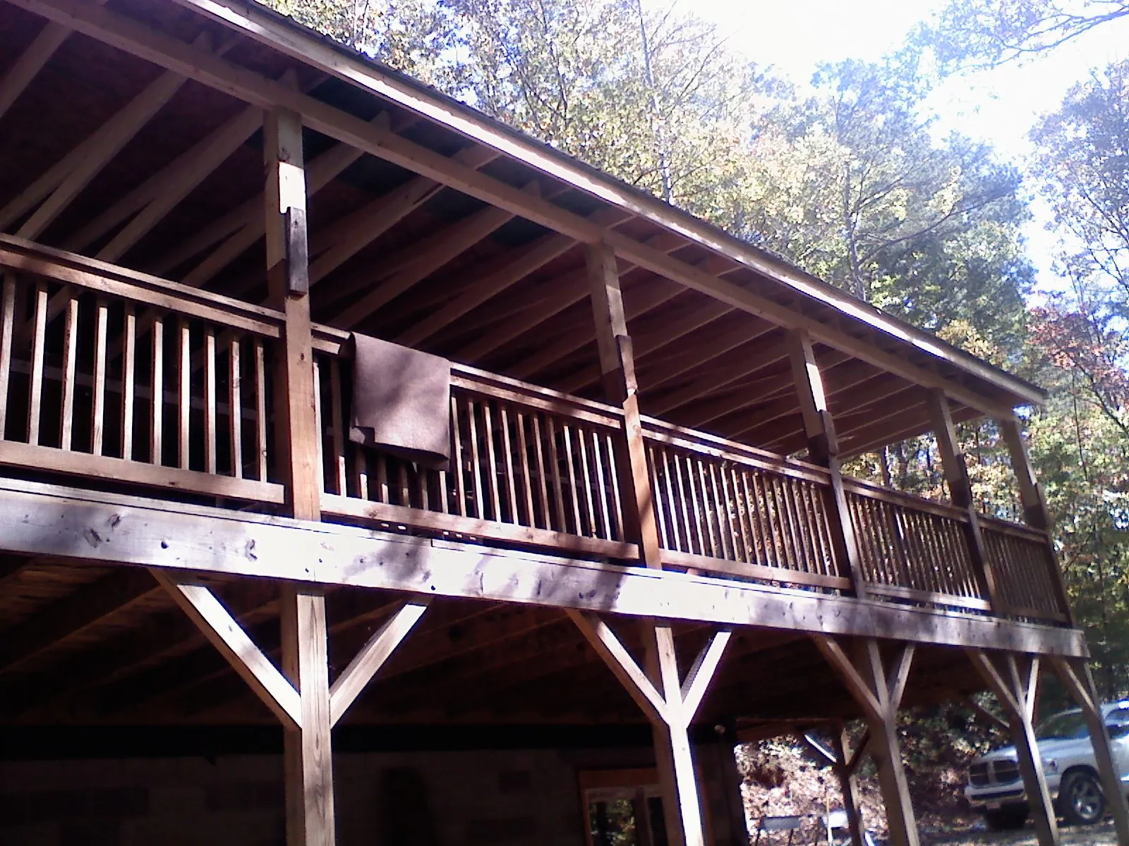Timber framing under a new elevated porch and deck — Roof Leak Repair in Cotuit by Roofing Brothers